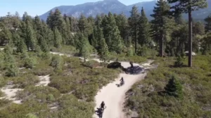 Electric dirt bike riders on a forest trail near South Lake Tahoe