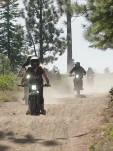 Riders on the electric dirt bike tour in the forest near South Lake Tahoe