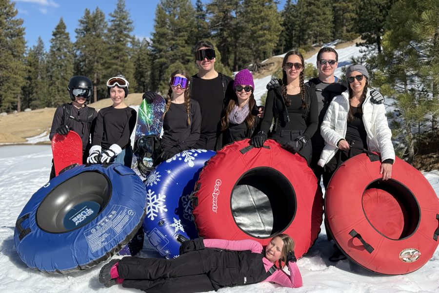Family with snow tubes at a private sledding spot near Lake Tahoe